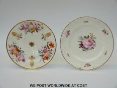 A plate decorated with hand painted flowers in the Swansea style and another similar example