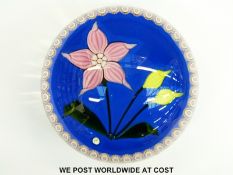 Phoenix Glass paperweight with a central pink and yellow flower surrounded but a ring of pink and