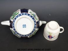 A first period Worcester coffee can with chinoiserie decoration and a Worcester teapot