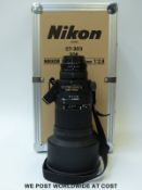 Nikon ED AF Nikkor 300mm 1:2.8 camera lens with leather cover in fitted flight case.