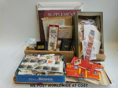 A large quantity of loose stamps together with album supplement sheets, a GB Concise catalogue,