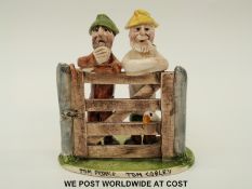 A Will Young pottery group of Tom Pearse and Tom Cobley leaning on a gate,