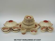 A large collection of Susie Cooper dinner and tea ware decorated with concentric circles