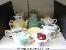 A collection of Art Deco and retro teapots, some with hot water bases including Poole,