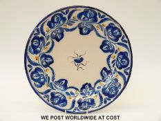 An 18thC Delft charger with blue decoration and RC initials verso (35cm diameter)
