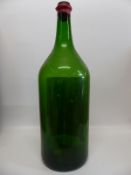 An empty Balthazar sized bottle of Cotes du Marmandais complete with wooden case