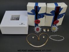 Two Swarovski Collectors' Society daisy ring holders and a jewellery makers kit,