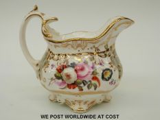 An early 19thC hand decorated English porcelain milk jug,