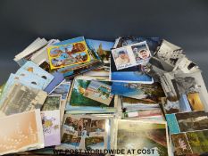 A large collection of loose postcards circa 1902 to the present day