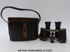 A cased pair of Goerz German military 6 x 30 Mariné Trieder binoculars with further markings to