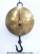 A circular brass dial Salter spring balance calibrated in both pounds and pints / gallons