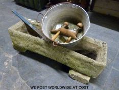 A garden trough, large wrench,