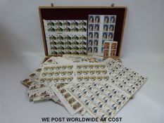 A quantity of mint GB stamps in a cigar box,