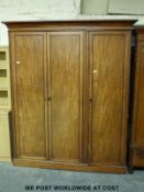 A 19thC mahogany three door wardrobe (H208cm x W175cm x D42cm)