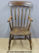 A 19thC elm seated Windsor armchair