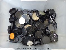 A box of camera lens caps
