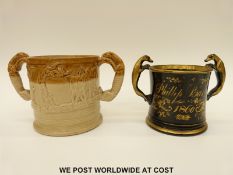 A salt glazed jug with relief moulded hunting scenes and handles in the form of dogs and another