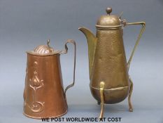 An Arts and Crafts hammered teapot raised on hoof feet with impressed two fish mark,