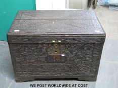 A possibly Burma/South East Asia hardwood jewellery or silver chest with textured bark carved