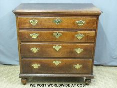 A George III oak chest of drawers with blind top drawer and lift up lid (H100 x W102 x D56cm)