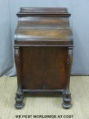 A Victorian rosewood piano top Davenport, the rising top with fitted drawers,