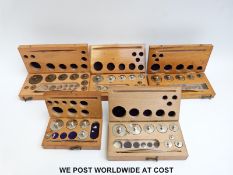 Five cased sets of metric weights