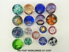 Seventeen Caithness glass paperweights, some limited editions including Overseer,
