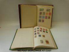 An album containing GB and world stamps mint and used from early issues and a second album of mint