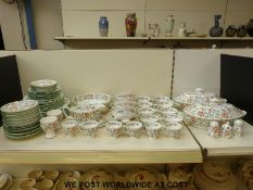 Minton dinner and tea ware in Haddon Hall pattern including two tureens, gravy boat, cruet etc.