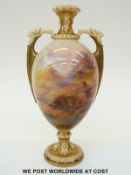 Royal Worcester twin handled pedestal vase hand decorated with scenes of Highland cattle,