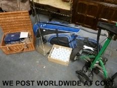 A set of golf clubs, twenty golf balls, motorised trolley, lamp,