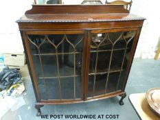 An astragal glazed bow front display cabinet (H135cm x W120cm x D38cm)