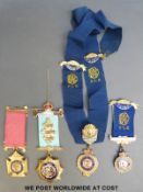 A small collection of RAOB badges to include a hallmarked silver gilt example.
