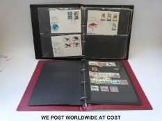 A stockbook of Rhodesia and South Africa stamps and an album of Rhodesia first day covers