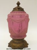 An Art Nouveau moulded and etched cranberry glass and gilt metal lamp, 39cm tall.