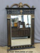 A bevelled glass mirror with ebonised and gilt frame with pineapple and fleur de lys finial (H140 x