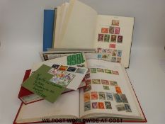 Two albums and a stockbook of European stamps and an album of covers