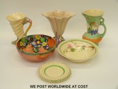 A small collection of Clarice Cliff including two vases and a bowl,