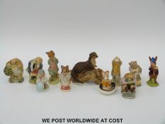 A quantity of Beswick figures including Beatrix Potter Sir Isaac Newton and Kitty McBride and