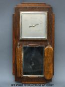 An Art Deco oak wall barometer with square dial together with brushes and mirror