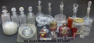 A collection of glass including ship's decanter, coloured glass, decanter stoppers,