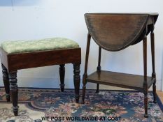 A small oval table and an upholstered stool.