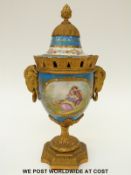 Sevres style jewelled and ormolu mounted pedestal urn with lion mask handles (29cm tall)