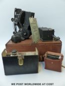 A Pathescope 9.5mm cine projector together with two vintage cameras.