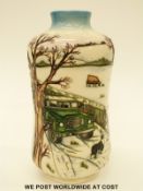 Moorcroft waisted vase decorated in the Winter Feed pattern featuring a Landrover traversing a