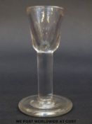 A Georgian firing glass with deceptive bowl over slightly swollen stem raised on thick foot, 10.