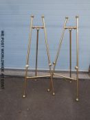 A pair of brass easels for gallery,