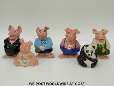 A set of Wade Nat West pigs including Sir Nathaniel together with a Wade panda money box