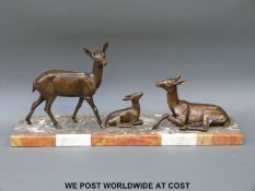 An Art Deco spelter figural group of a three deer on a marble base (W65cm)