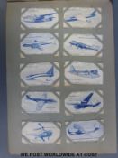 A cigarette card album including Turf Footballers, Famous Dog Breeds,
